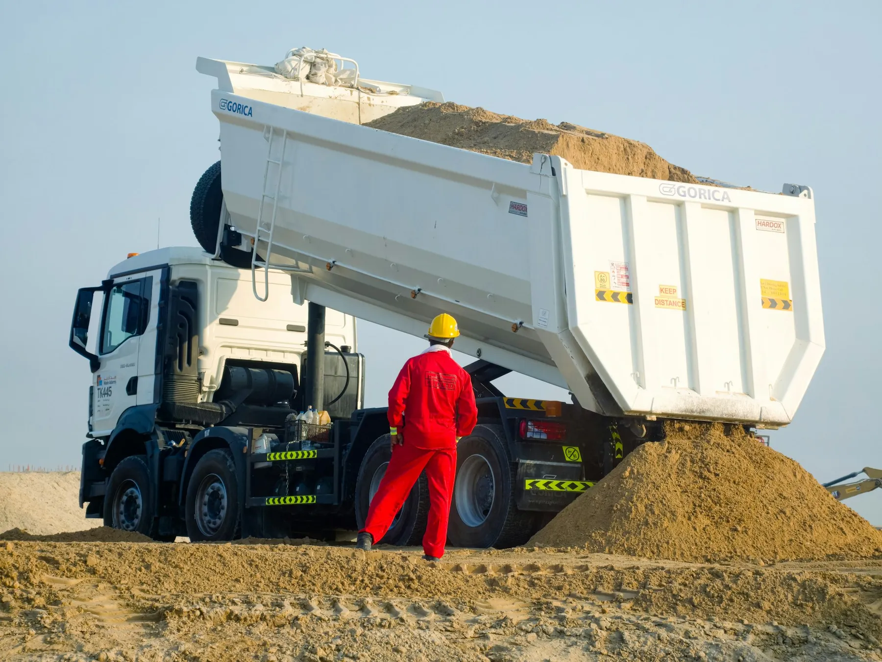 Tipper truck unloading sand at a site in Dubai
